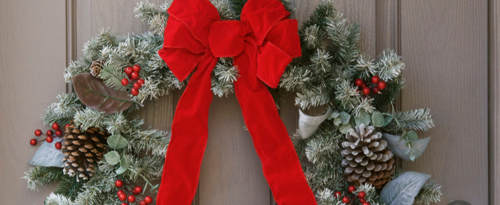 Christmas wreath on grey door.